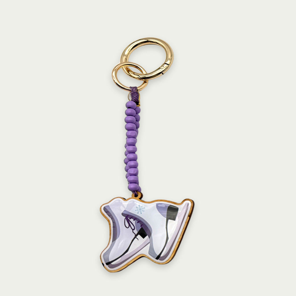Escapulario Taschenanhänger Schlittschuh als charmanter winterlicher Bagcharm für Taschen und Handtaschen eine witzige Geschenkidee für sportliche Damen.