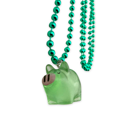 Kugelkette Metallic Grün mit fluoreszierendem Schweinchenanhänger aus Acryl
