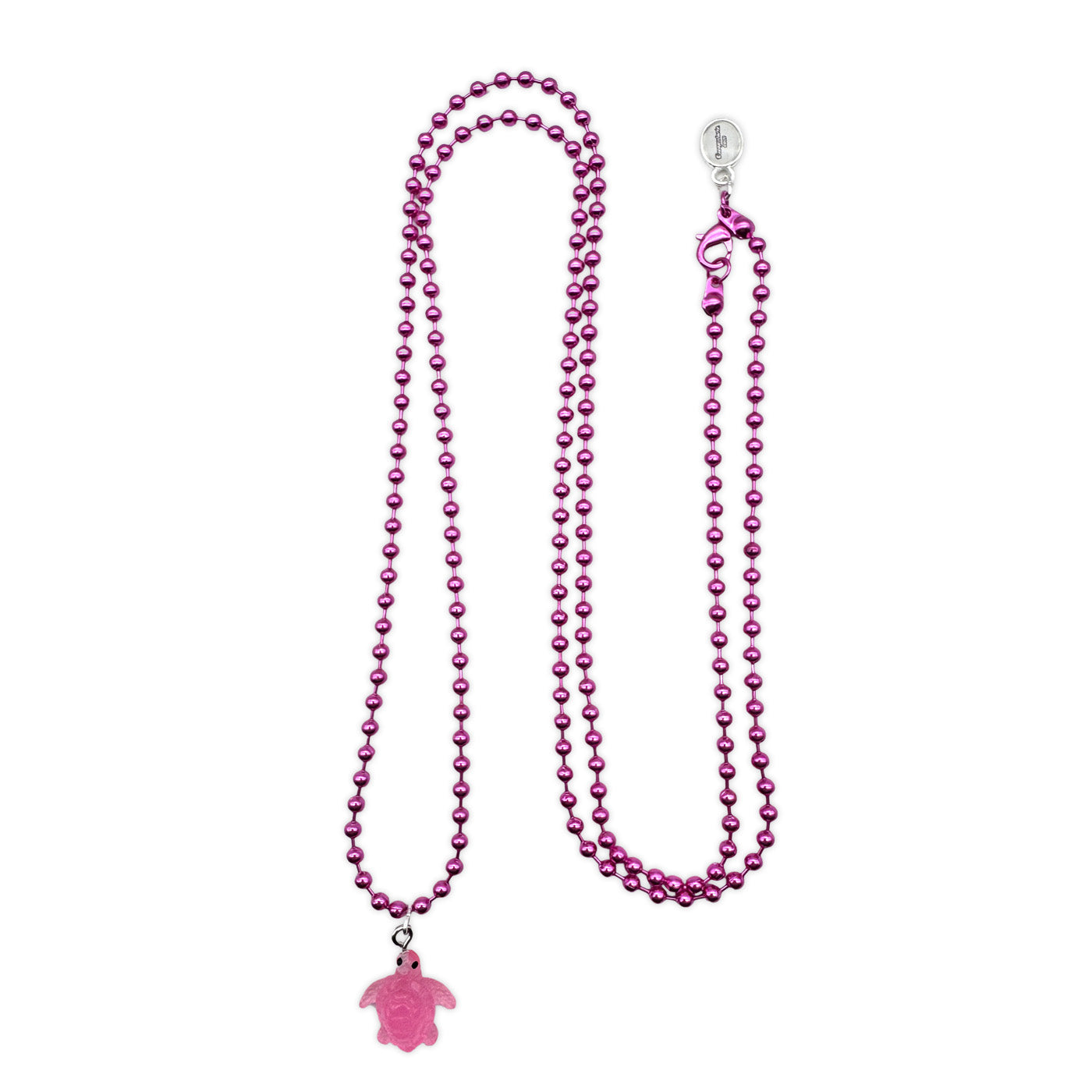 Escapulario Halskette für Damen als Metallic Kugelkette in Pink mit fluoreszierender Schildkröte aus Acryl.