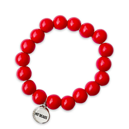 Escapulario Holzarmband in Koralle aus 12mm Perlen mit elastischem Band als leuchtendes sommerliches Armband für Damen.