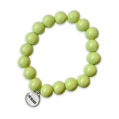 Escapulario Holzarmband in Pistazie aus 12mm Perlen mit elastischem Band als frisch grünes sommerliches Armband für Frauen.