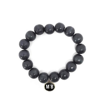 Escapulario Holzperlenarmband in Schwarz aus 12mm Holzperlen mit elastischem Band als lässiges zeitloses Accessoire für modebewusste Damen.