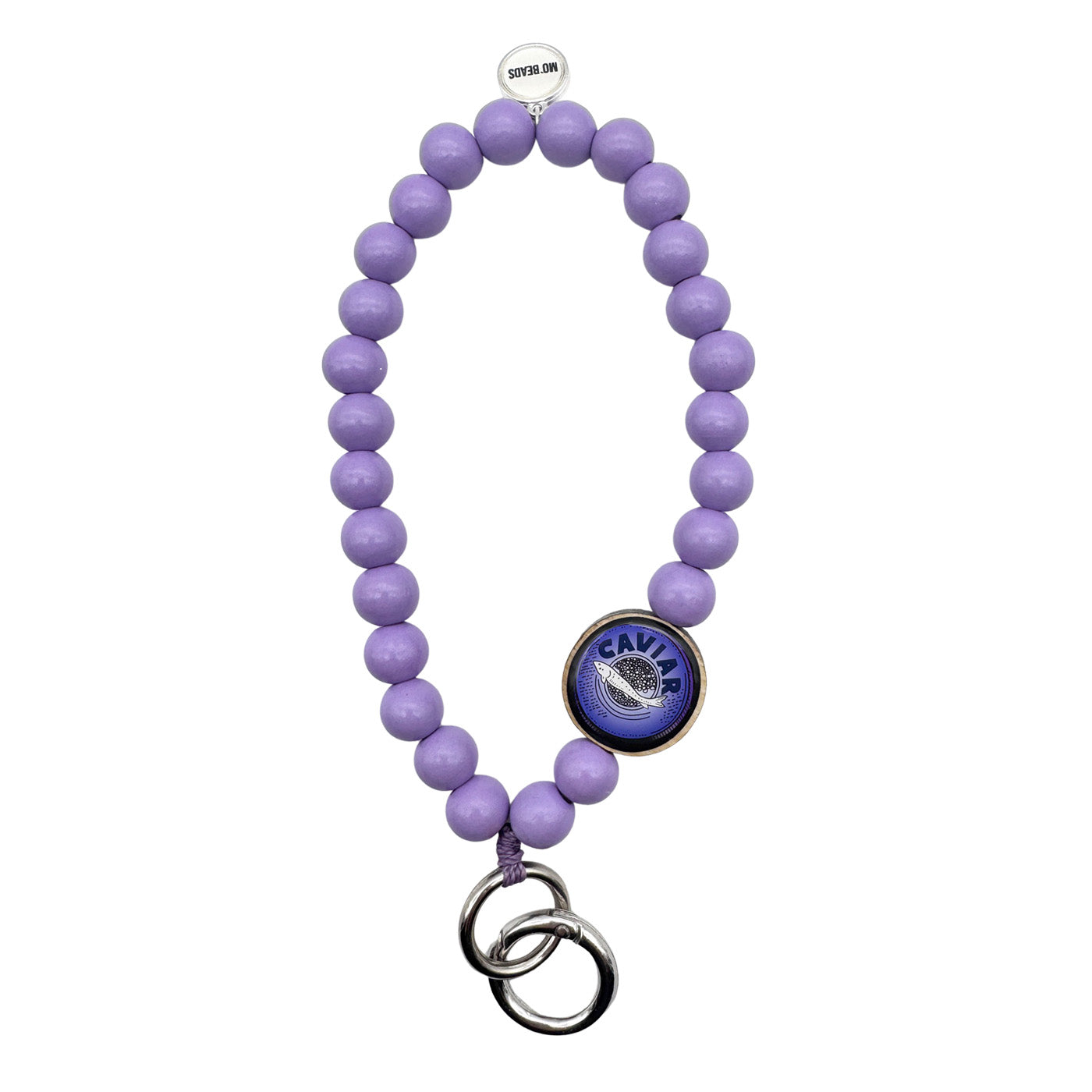 Escapulario Schlüsselkette in Flieder mit Caviar-Pin aus Holz und Metallkarabiner als außergewöhnliches Accessoire für stilbewusste Damen.