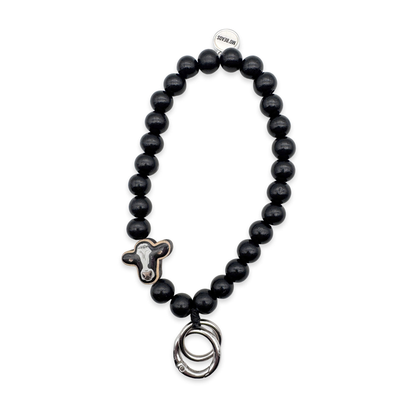 Escapulario Schlüsselkette in Schwarz mit Kuh-Holzpin aus Holzperlen als verspieltes Accessoire für Frauen, die ihre Schlüssel stilvoll tragen möchten.