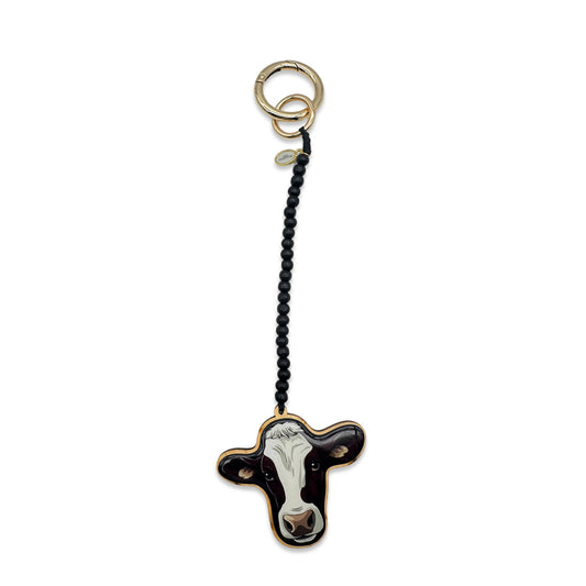 Escapulario Taschenanhänger Kuh als witziger verspielter Bagcharm für Handtaschen und Taschen als lustiges Accessoire für Frauen.