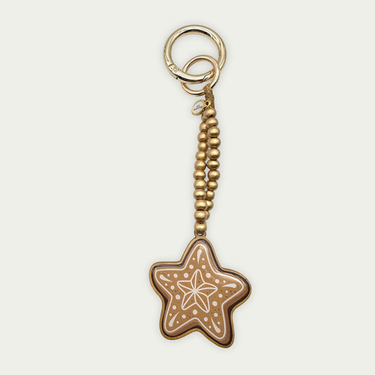 Escapulario Taschenanhänger Lebkuchenstern als festlicher weihnachtlicher Bagcharm für Taschen und Handtaschen als besonderes Accessoire für Frauen.