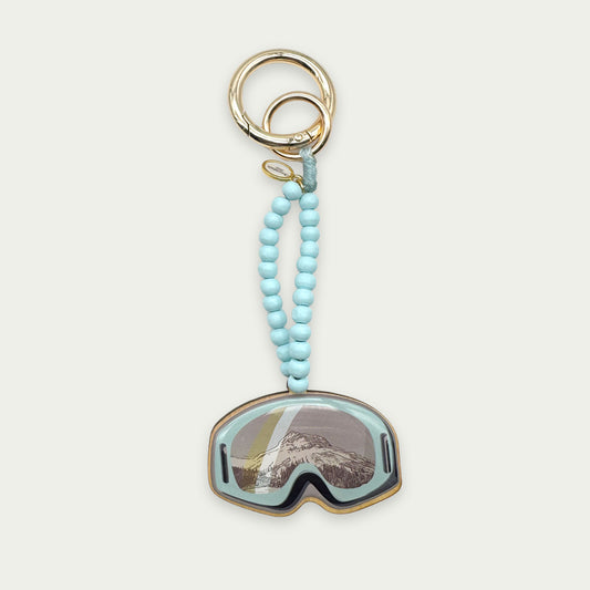 Escapulario Taschenanhänger Skibrille als witziger winterlicher Bagcharm für Taschen und Handtaschen als einzigartiges Accessoire für Frauen.